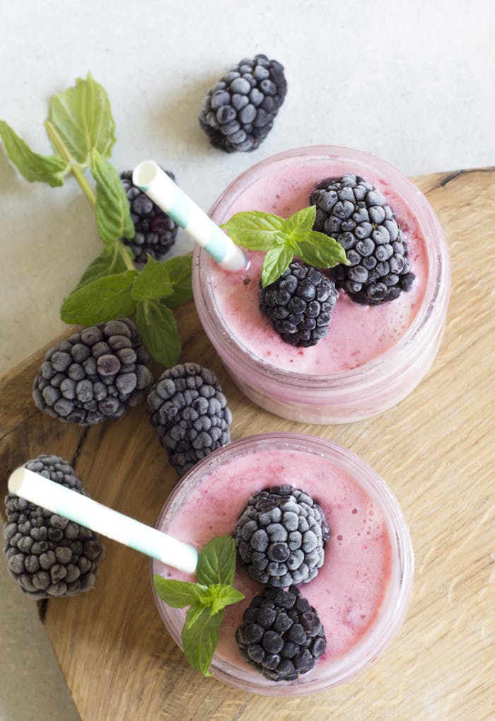 The Art of Drawing Readers In: Your attractive post title goes here Enjoy a refreshing blackberry smoothie topped with fresh mint leaves, perfect for a summer treat.